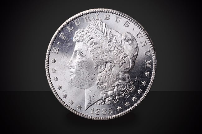 1885-CC Morgan Dollar Select BU Coin Against a Black Background