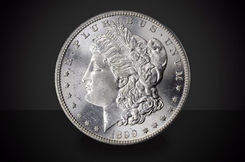 1899 Morgan Dollar Select BU Coin Against a Black Background