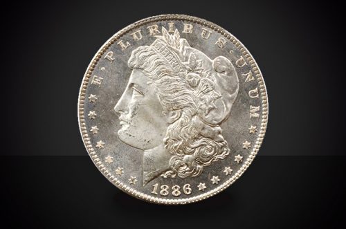 1886 O Morgan Dollar Choice Borderline Uncirculated Coin Against a Black Background
