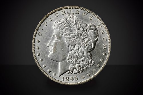 1893 O Morgan Dollar Choice Borderline Uncirculated Coin Against a Black Background