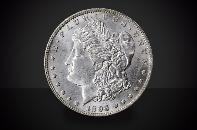 1896 O Morgan Dollar Choice Borderline Uncirculated Coin Against a Black Background