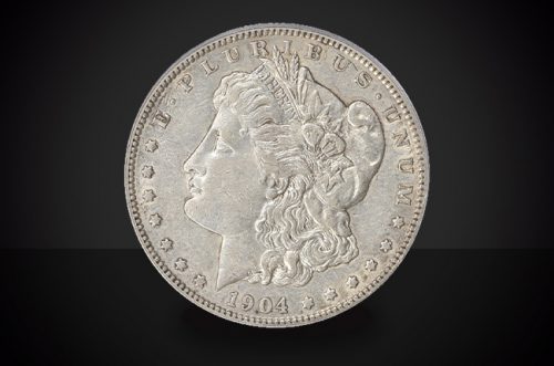 1904 S Morgan Dollar Choice Borderline Uncirculated Coin Against a Black Background