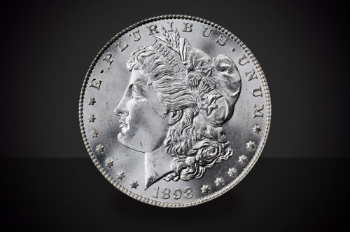 1883 S Morgan Dollar Choice Borderline Uncirculated Coin Against a Black Background