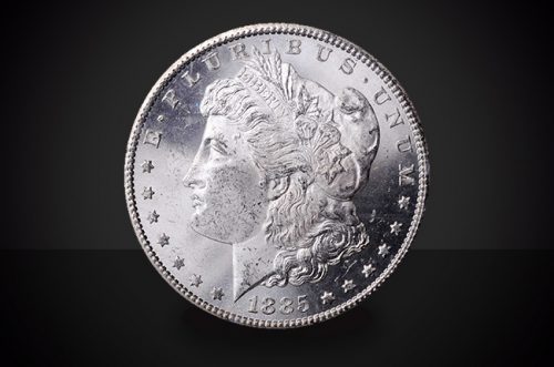 1885 S Morgan Dollar Choice Borderline Uncirculated Coin Against a Black Background