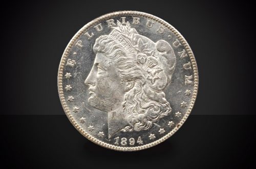 1894 S Morgan Dollar Choice Borderline Uncirculated Coin Against a Black Background