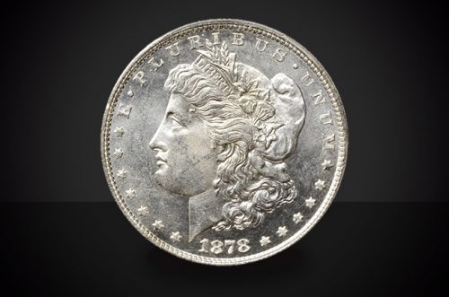 1878 CC Morgan Dollar Choice Borderline Uncirculated Coin Against a Black Background
